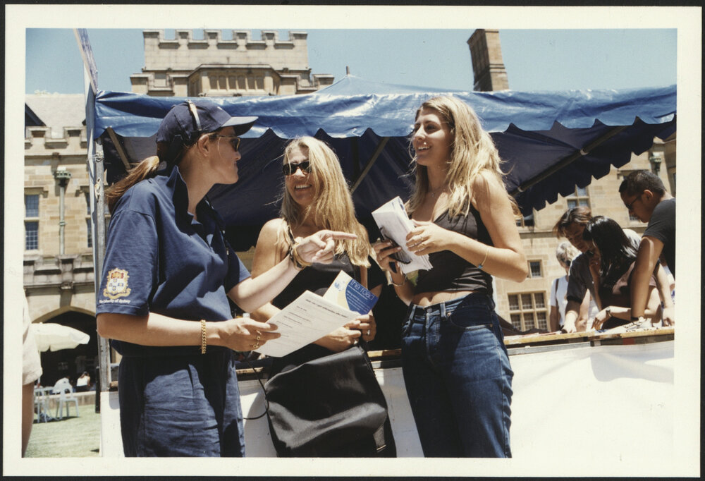 University Volunteer with Prospective Students at an Information Boot on Information Day 1999