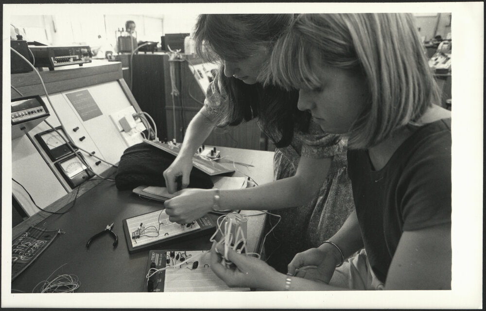 Two Women Electrical Engineering Students at Workbench