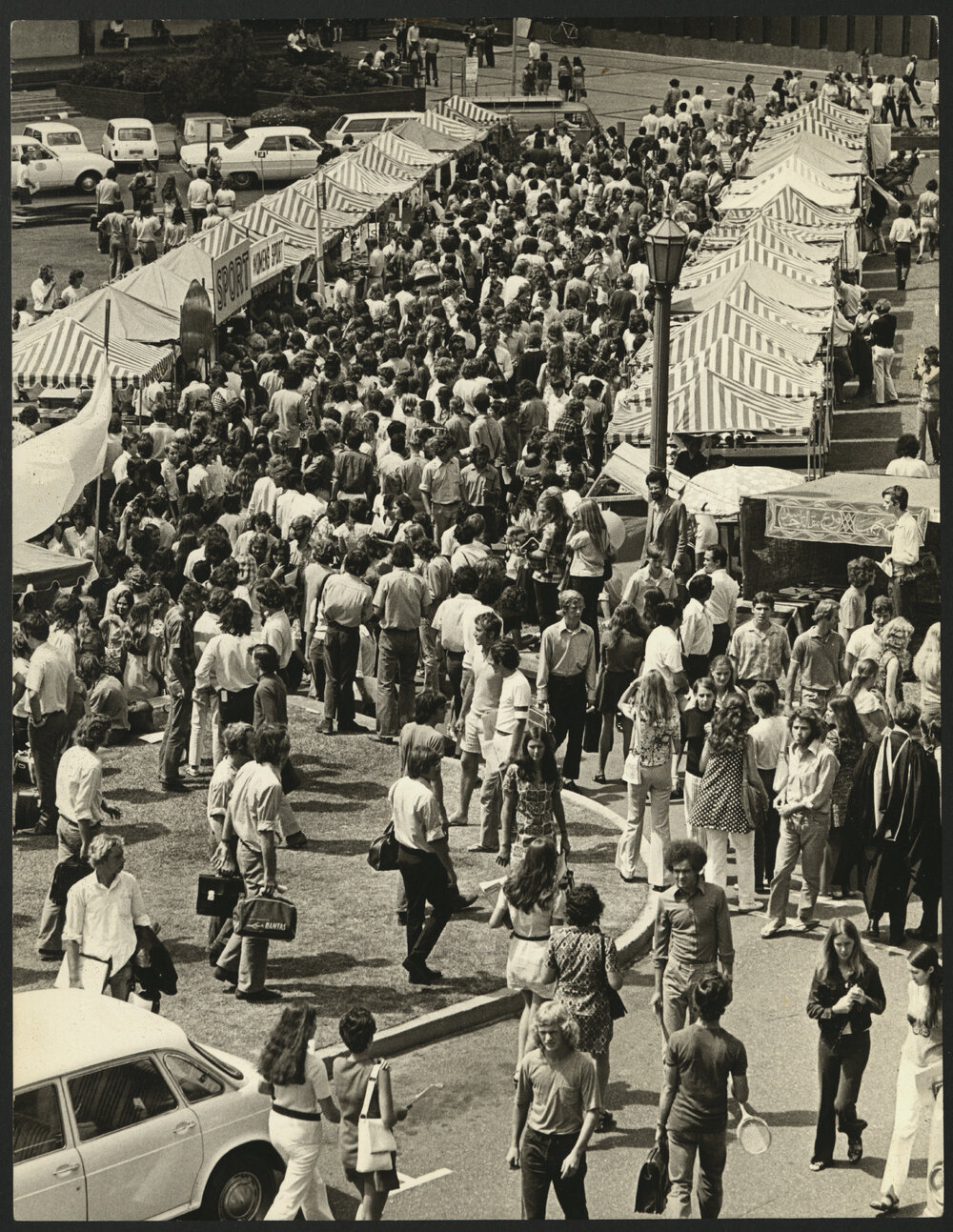 Crowd of Students Walking Between the Stalls on Front Lawn for Orientation Week