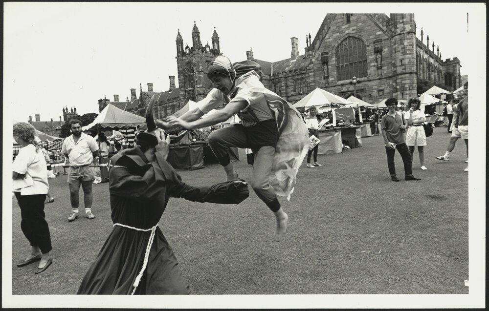 Students in Medieval Dress Acting Out on the Front Lawn During Orientation Week
