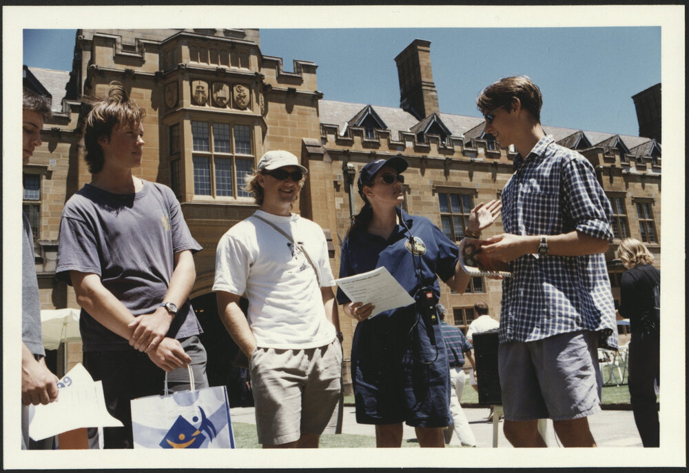University Volunteer Assisting Prospective Students Standing in the Quadrangle at Information Day 1999