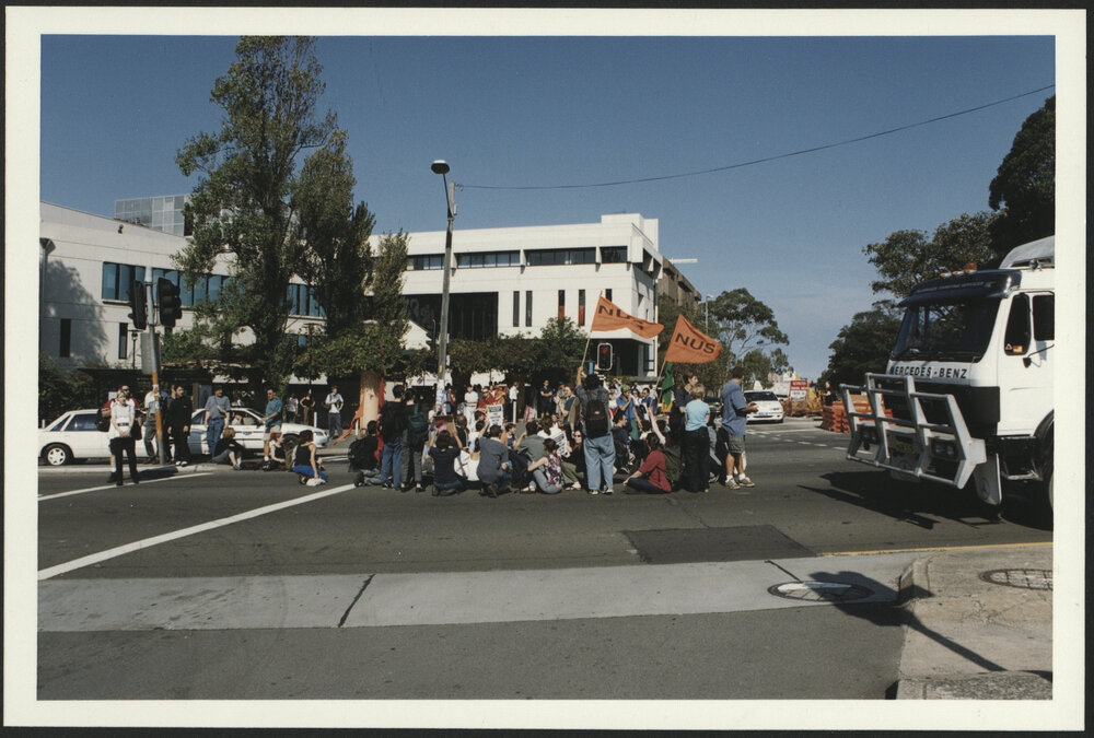 Student Sit-In on City Road with Students Holding National Union of Students (NUS) Banners