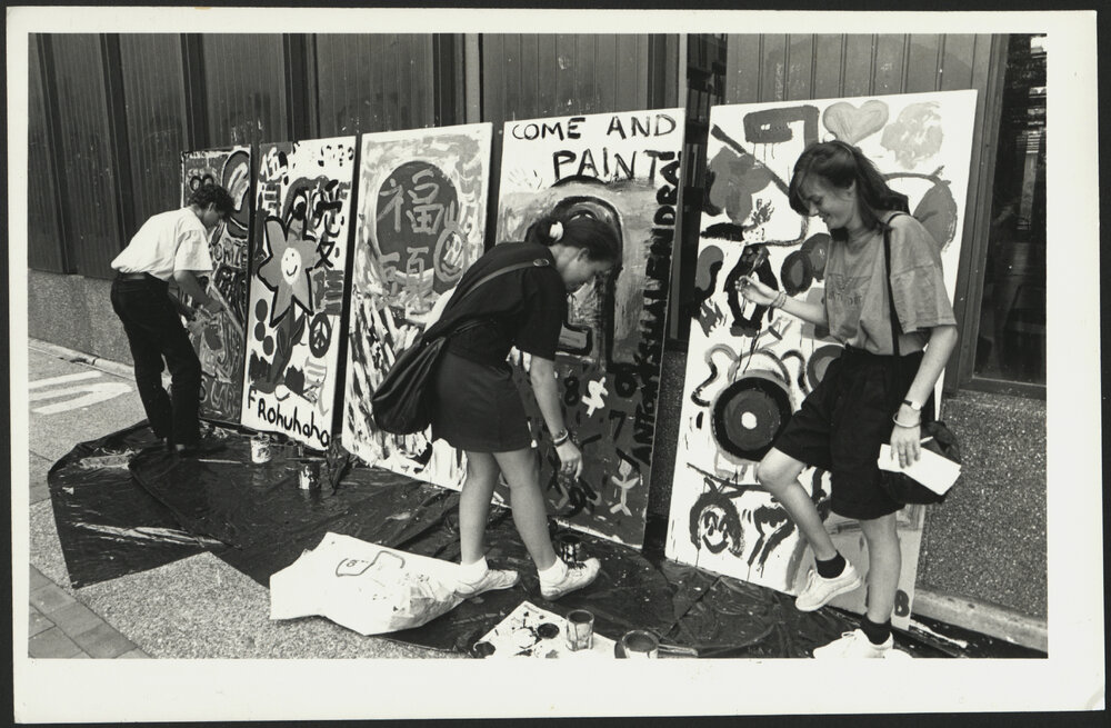 Students Painting on Panels Outside Fisher Library During Enrolment 1989