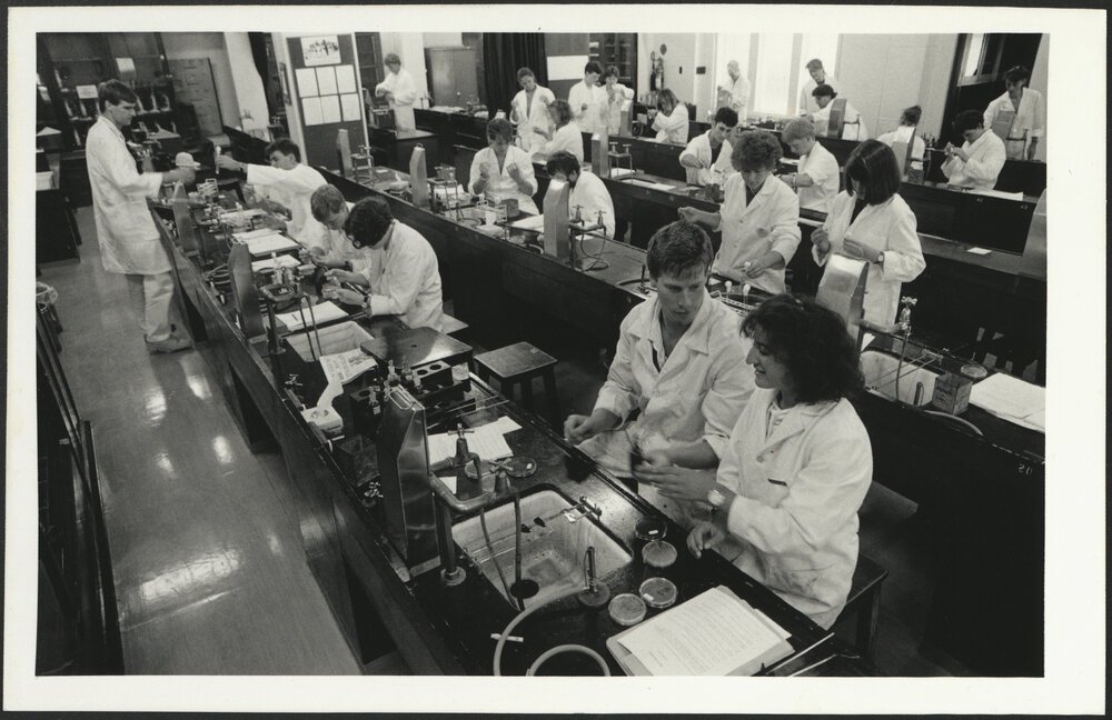 Old Pharmacy Laboratory with Third Year Students Working at Several Long Benches