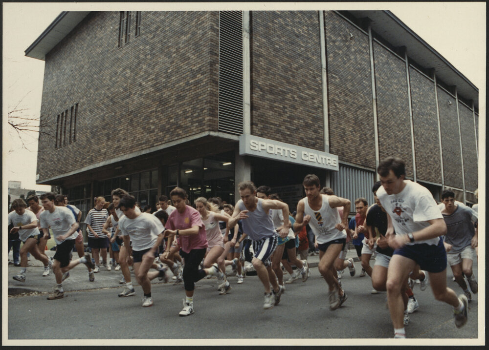 Sport and Recreation - Students Passing the Sports Centre While in a Race