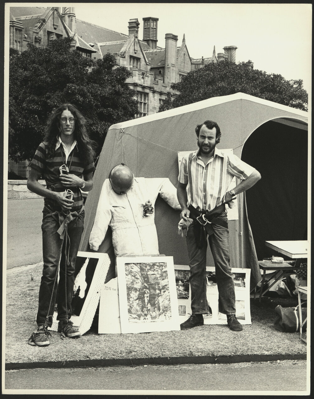 Two Students in Climbing Gear Outside a Tent on the Front Lawn During Orientation Week