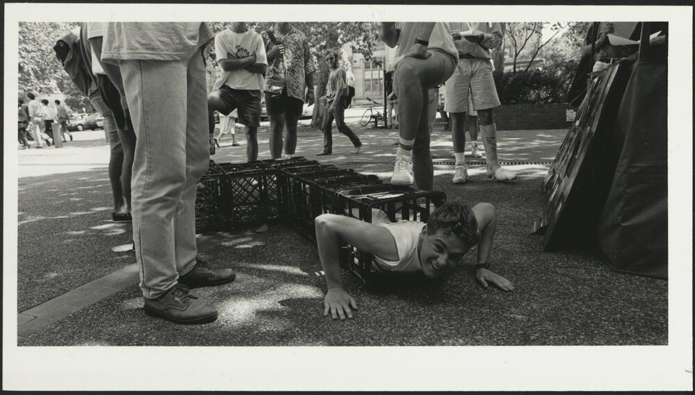 A Student Emerges from a Milk Crate Tunnel During Orientation Week 1992