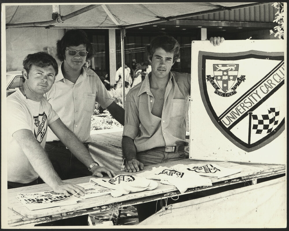 Three Students Manning the University Car Club Stand at Orientation Week