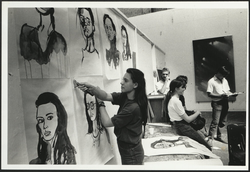 Sydney College of the Arts (SCA) Students in Studio Relaxing While One Student Takes Down Portrait Paintings