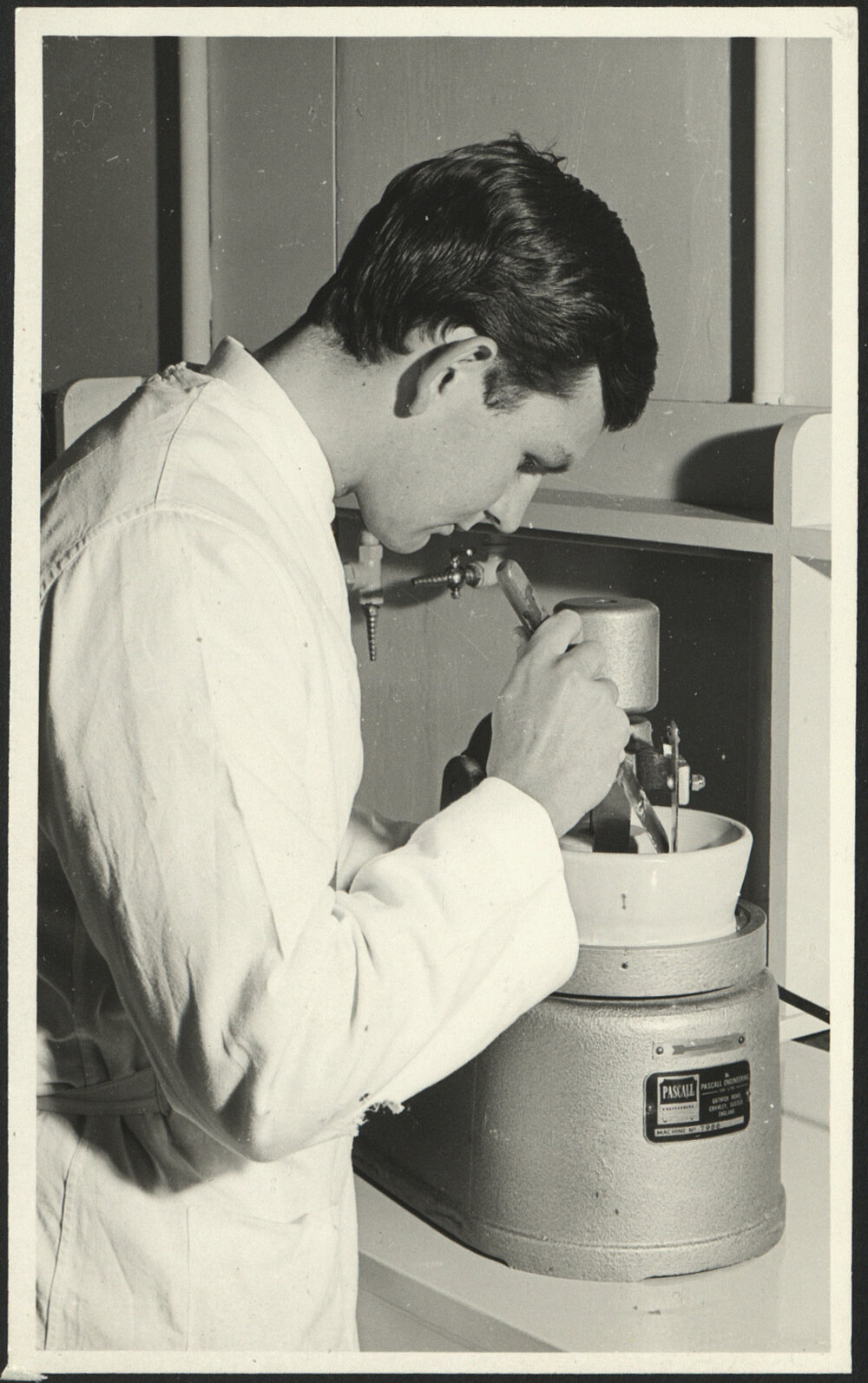 Pharmacy Laboratory - Student Using Automatic Mortar and Pestle