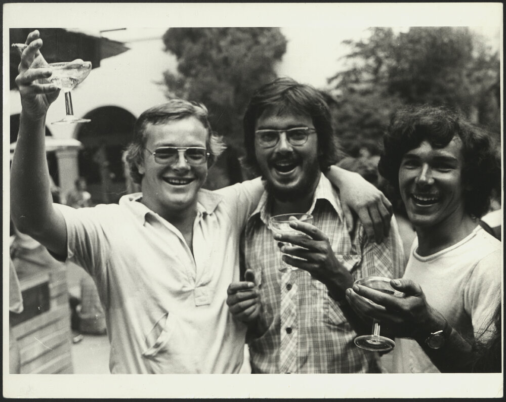 Three Students Toasting with Champagne Glasses at "Meet the Board" Union Pleasance, Orientation Week 1978