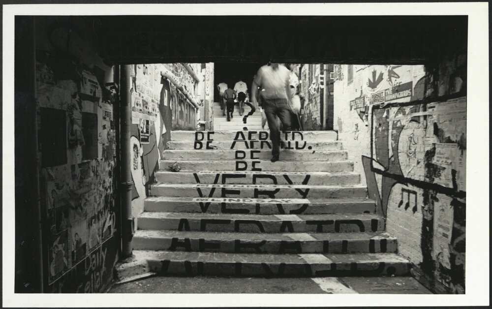 Stairs in the Graffiti Tunnel Displaying the Text 'Be Afraid Be Very Afraid'