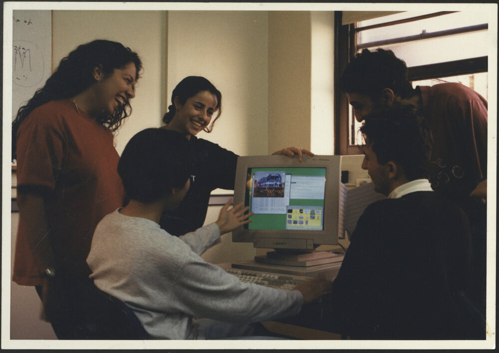 Five Engineering Students Around the Screen of a Computer