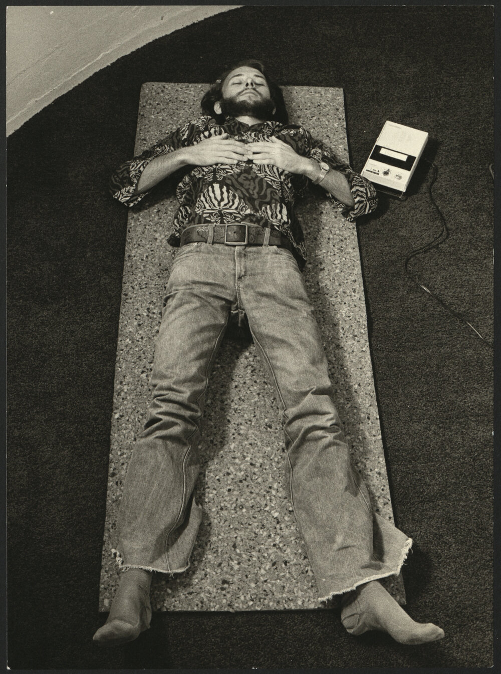 Relaxation Exercise with Student Lying Outstretched on Yoga Mat