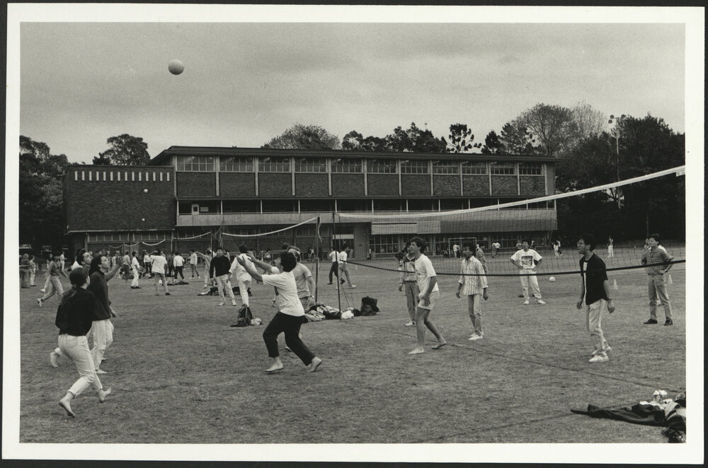 Students Play a Lunchtime Volleyball Game on the Hockey Field