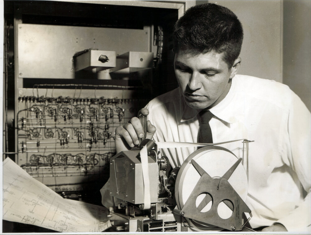 Brian De Ferranti with SILLIAC Punch Tape Reader