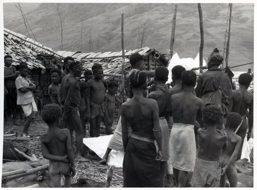 Group Gathered in Front of Buildings