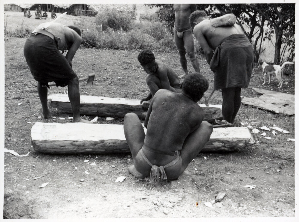 Men Preparing a Log Coffin