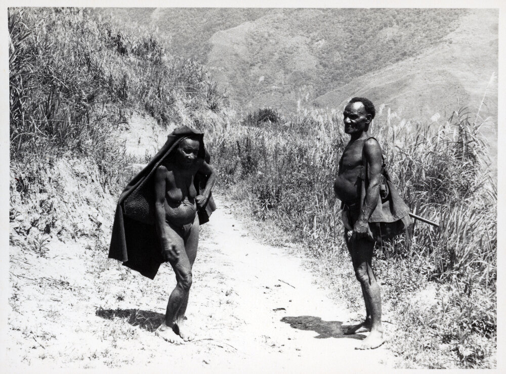 Woman and Man Standing on Path