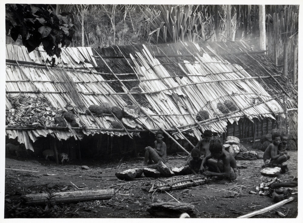 Group Sitting in Front of Building