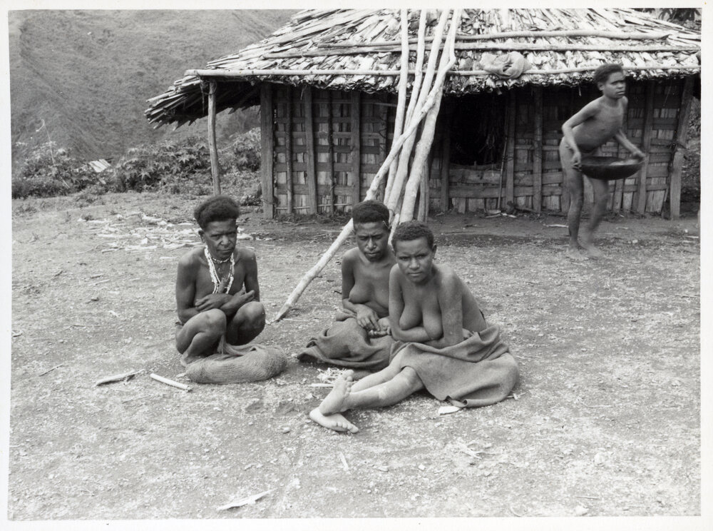 Group Sitting in Front of Building