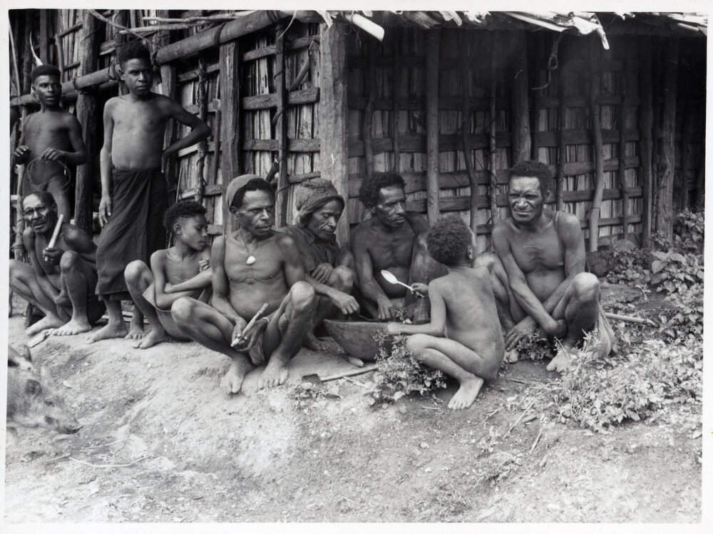 Group Sitting in Front of Building