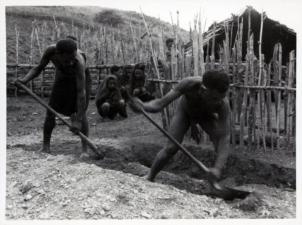 Men Digging Grave