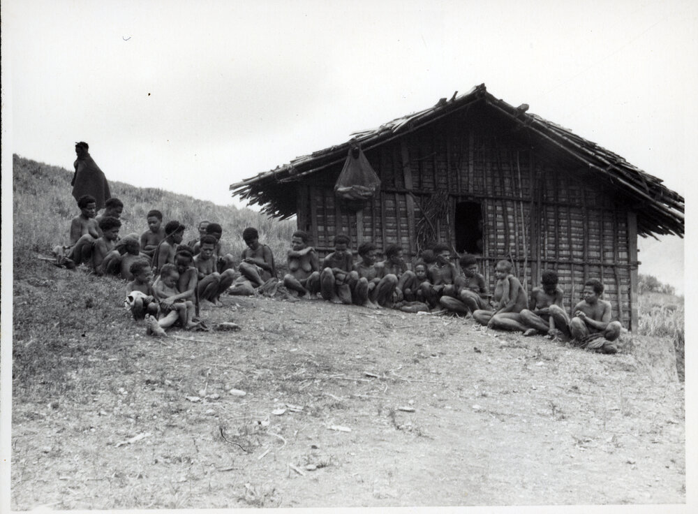 Group Sitting in Front of Building
