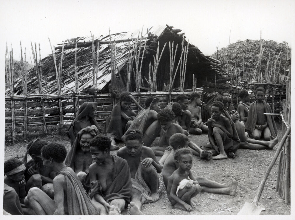 Group Sitting in Front of Building