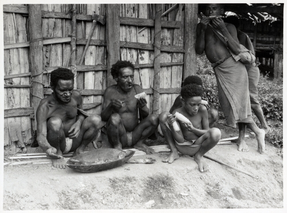 Men and Children Eating