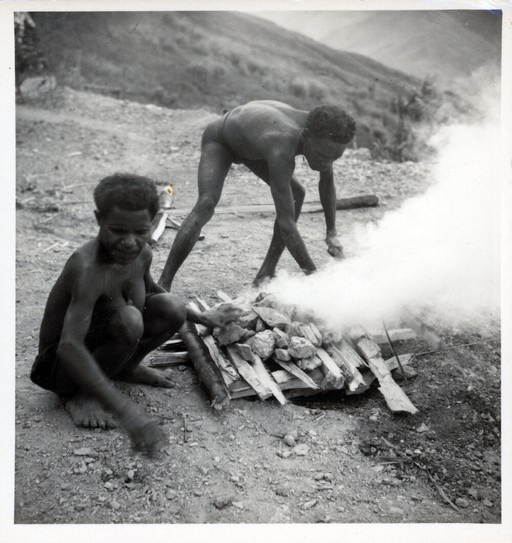 Men Preparing a Fire