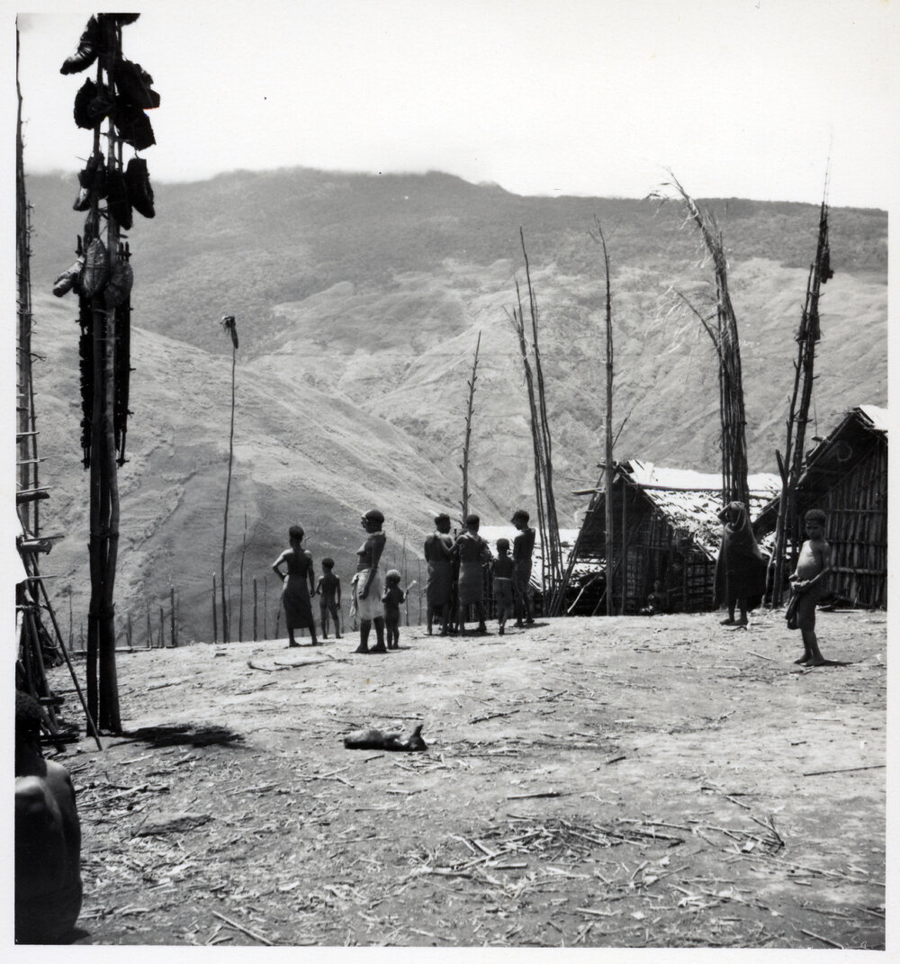 Group Standing in Mountainside Hamlet