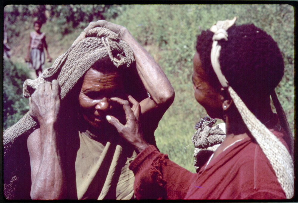 Two Women with Net Bags