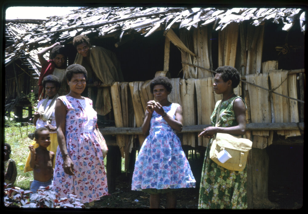 Women Standing in Front of a Building