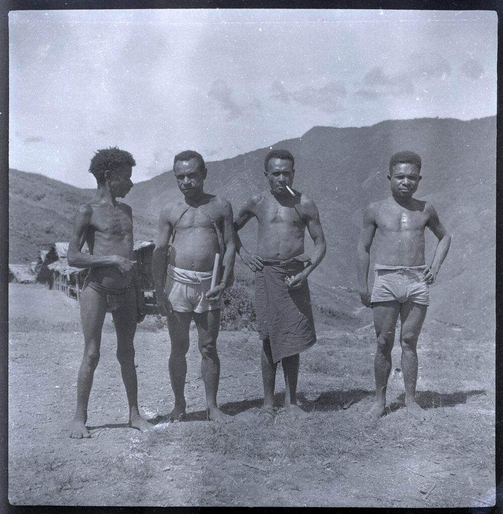 Four Men Standing Near Hamlet