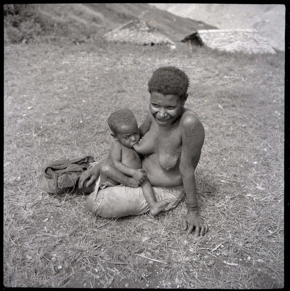 Woman Breastfeeding Child