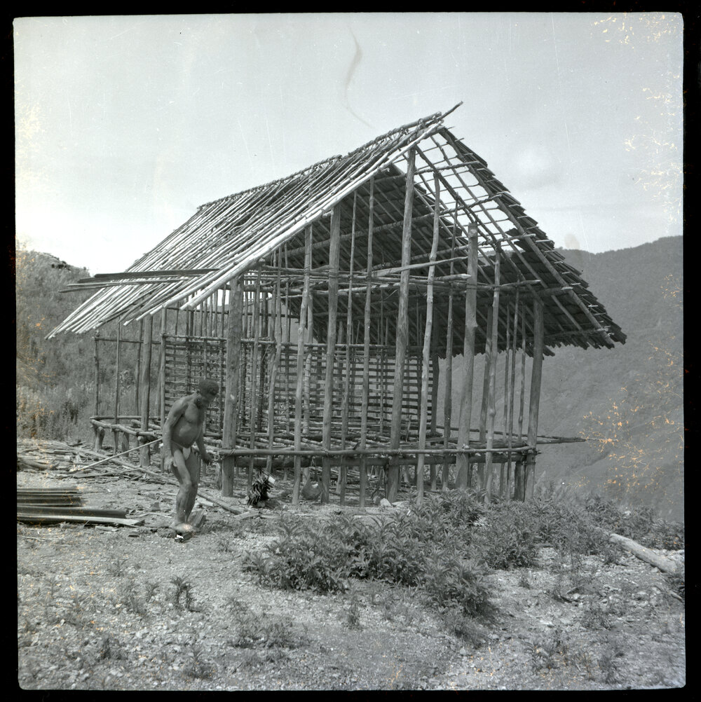 Man Standing in Front of Partially-Constructed Building
