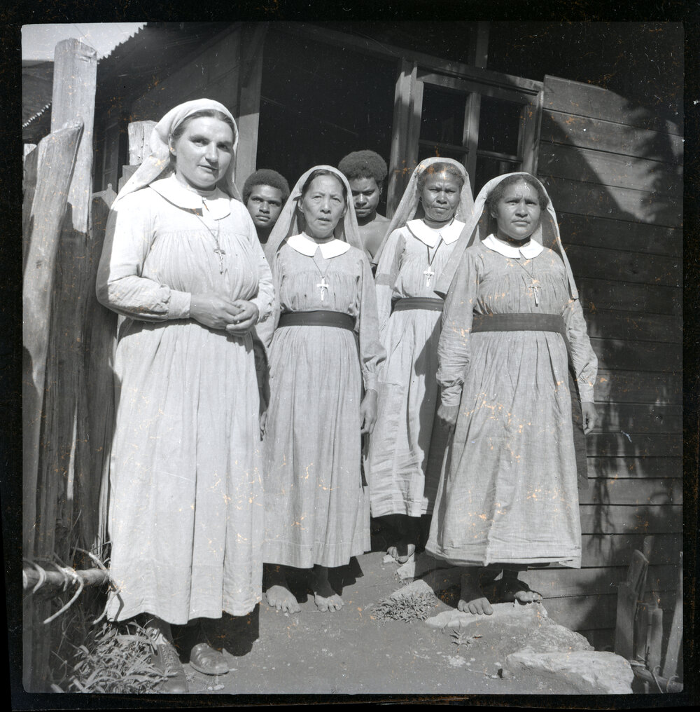 Group Standing at Building Entrance