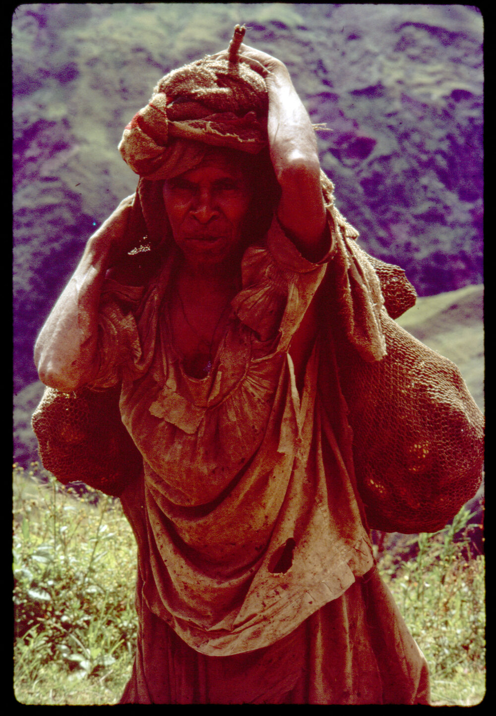 Woman Carrying Bag of Sweet Potatoes