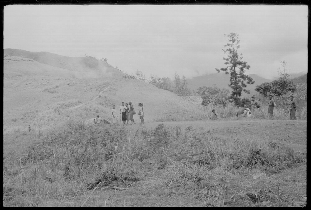 Groups of People Gathered Across Mountain