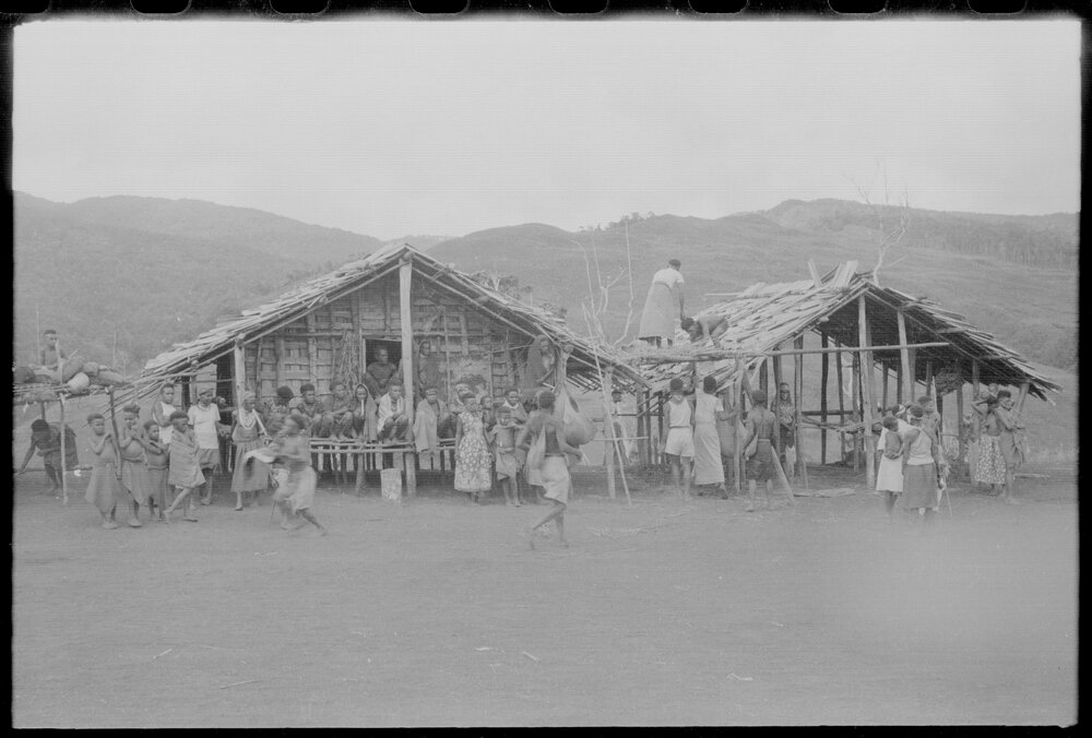 People Gathered Around a Building