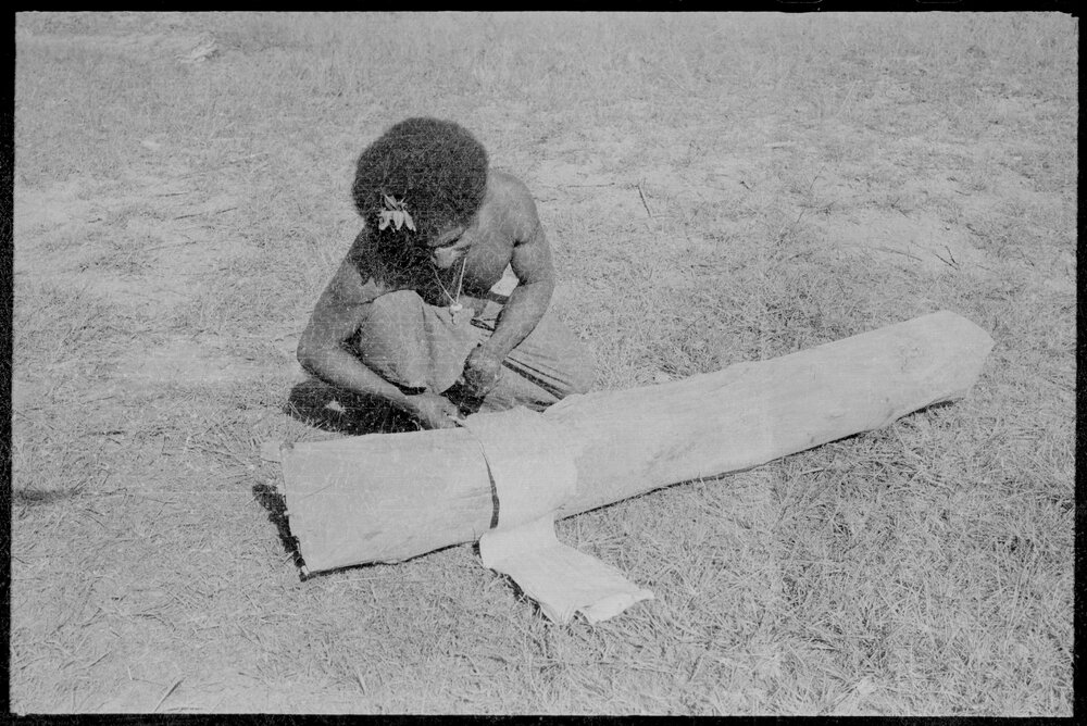 Man Processing Tree Bark