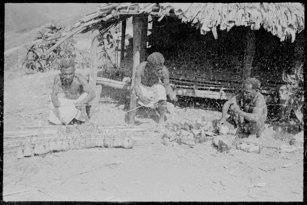 Men Preparing Pandanus Nut