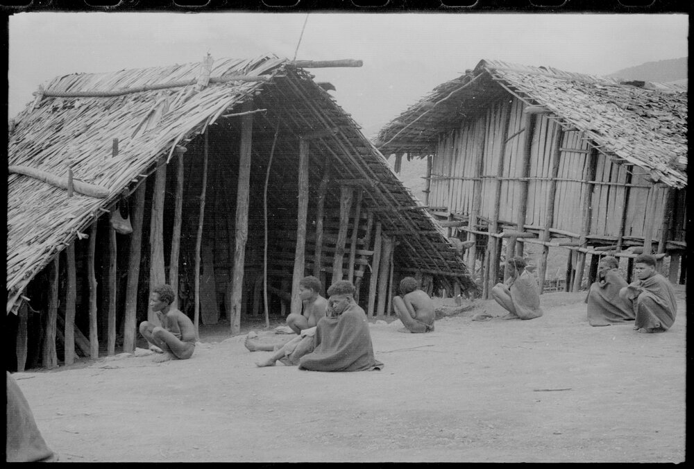 Group Sitting Outside a Building