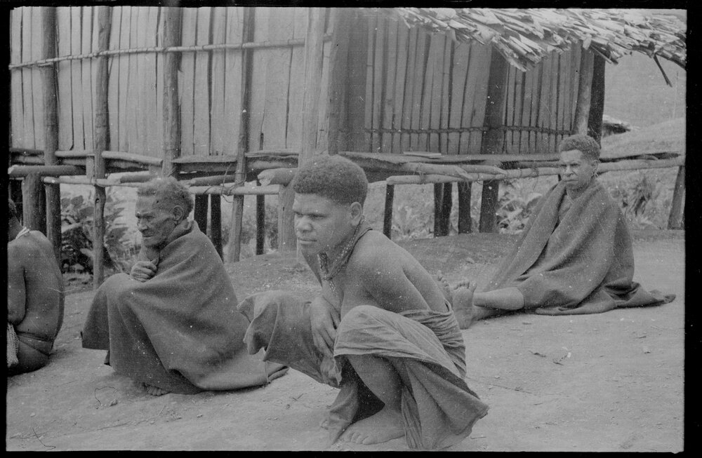 People Sitting Outside a Building