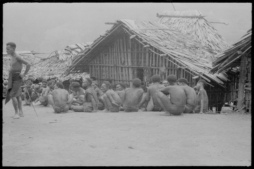 Group Gathered Outside Buildings