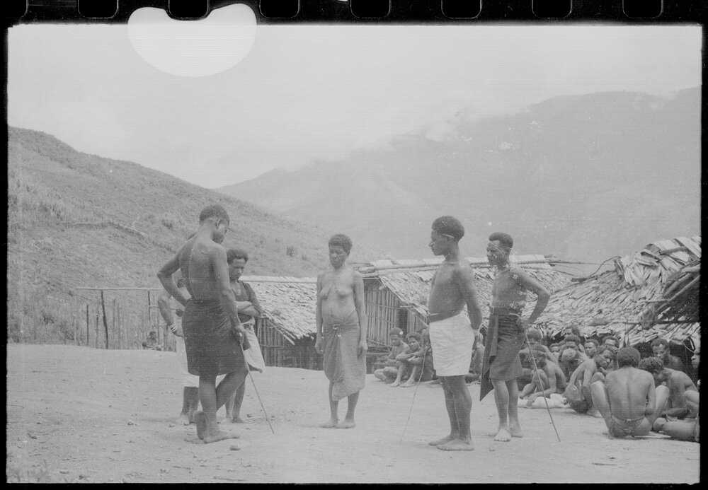 Group Gathered Outside Buildings