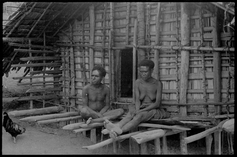 Man and Woman Outside a Building