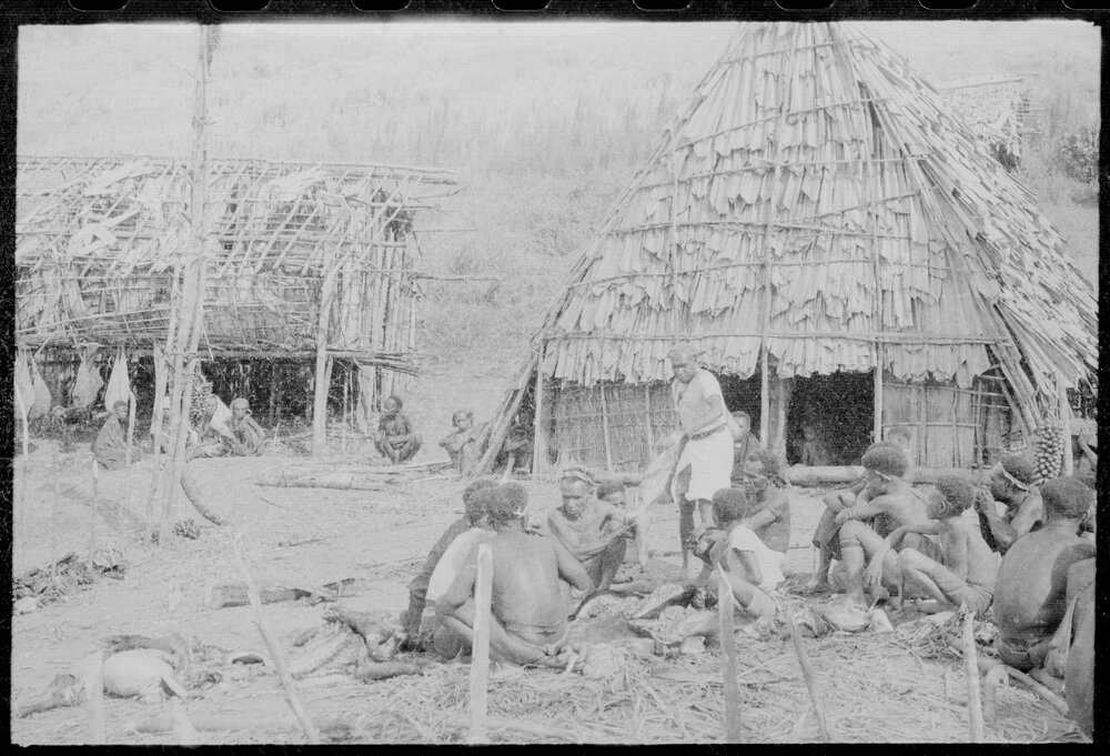 Group Gathered Outside Buildings
