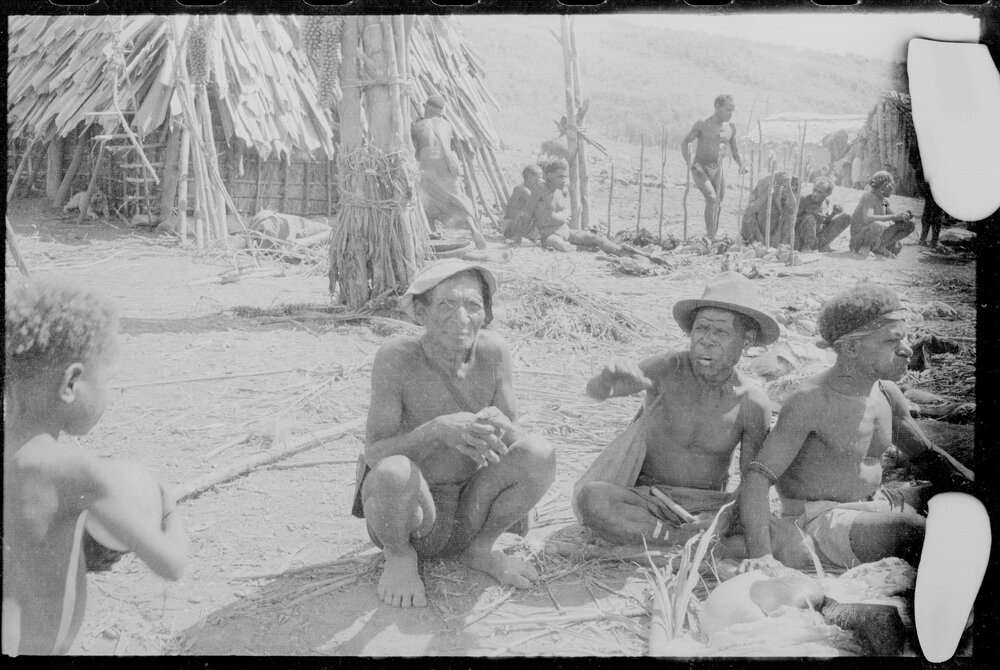Group Sitting Outside a Building